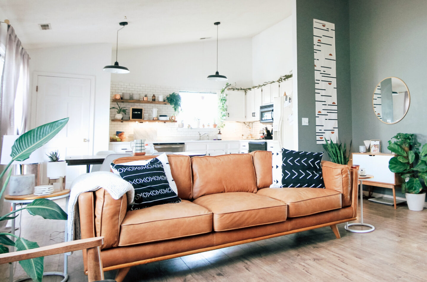Living room with couch and open kitchen after a well-planned move